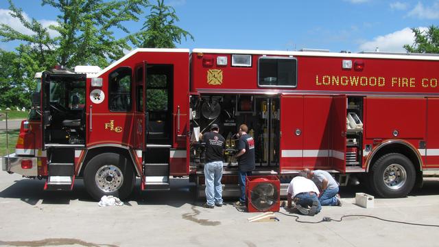 Members completing an equipment check on Rescue 25